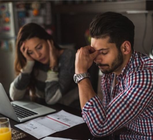 Couple checking their sales report